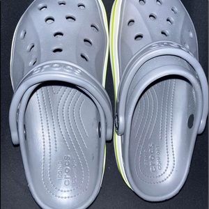 Grey and green crocs